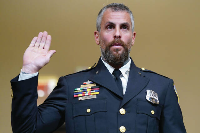 129042382_web1_APofficer-jan-6-cmyk
Washington Metropolitan Police Department officer Michael Fanone is sworn in to testify to the House select committee hearing on the Jan. 6 attack on Capitol Hill in Washington, July 27, 2021. (AP Photo/ Andrew Harnik, Pool)
