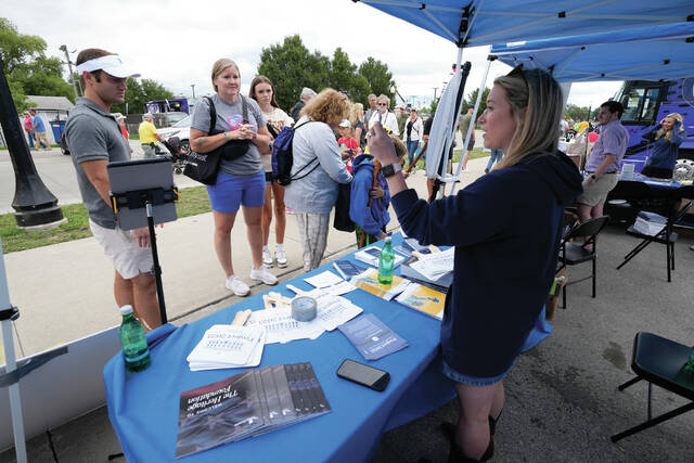 129946604_web1_APconservative-cmyk-
Kristen Eichamer, right, talks to fairgoers in the Project 2025 tent at the Iowa State Fair, Monday, Aug. 14, 2023, in Des Moines, Iowa. With more than a year to go before the 2024 election, a constellation of conservative organizations is preparing for a possible second White House term for Donald Trump. The Project 2025 effort is being led by the Heritage Foundation think tank. <em>(AP Photo/Charlie Neibergall) </em>