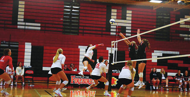 130002464_web1_volley-ball-
Claire Heilman (#14). The DLHS Firebirds met Grand Forks Red River on the volleyball court Sept. 21. The three matches were 4-25, 13-25 and 17-27 with Red River taking all three. <em>(photo by Noah Clooten, DLJ Sports)</em>