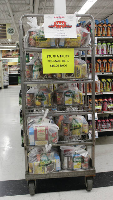 130115429_web1_stuff-a-truck-2023-
The pre-bagged items on this display are for Stuff-A-Truck holiday food drive. Just grab one or two and add to your grocery cart before checking out.