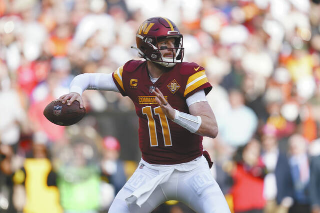 130135777_web1_Carson-Wentz-2
Washington Commanders quarterback Carson Wentz throws to a receiver in the first half of an NFL football game against the Cleveland Browns, Sunday, Jan. 1, 2023, in Landover, Md. The Los Angeles Rams are signing quarterback Carson Wentz, a person with knowledge of the deal tells The Associated Press. The source spoke on condition of anonymity earlier this month, because Wentz needed to pass a physical before the deal could be officially announced. <em>(AP Photo/Patrick Semansky, File) </em>