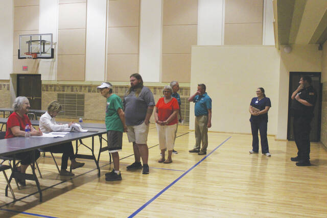 130686673_web1_voting-line-1-
Voters wait patiently to check in before voting, remember to have your current identification with you when you come to the polls. (archive photo - DLJ)