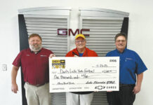 
			
				                                Scott Lyman (Sales Manager, Lake Chevy), Rick Grinsteiner (Devils Lake Youth Football), Wayne Brandt (General Manager, Lake Chevy). (Photo courtesy DL Cars)
 
			
		