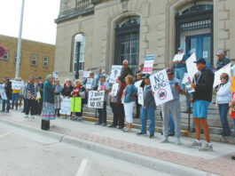 
			
				                                They started gathering at 10 a.m. and by 11:30 a.m. over 80 people had exercised their right to free speach and peaceful assembly guaranteed in the First Amendment of the Constitution of the USA at Devils Lake’s “No Kings” rally on the steps of the Lake Region Heritage Center, main street. Using a microphone and small speaker participants were invited to come forward and tell the crowd why they had come to this event. Although a few passersby expressed their opinions in opposition to the rally, many attending the rally did step up and express their concerns. Across the U.S. over 5 million people participated in the “No Kings” rally, estimated to be the largest demonstration in US history.
 
			
		