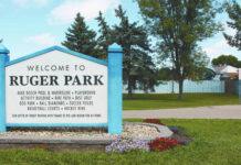 
			
				                                The sign at Ruger Park in Devils Lake shows the Pool and Water Slide in the background. (Photo by Louise Oleson, DLJ)
 
			
		
