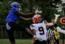 
			
				                                Marial Deng (1) reaches for a pass in Four Winds’ season opener against Larimore on Friday, Aug. 22. (Photo by Cameron Carlson)
 
			
		