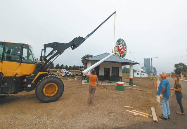 131801076_web1_Sinclair-Sign-liftcmyk
Gavin Brown stands below the sign being raised at the renovated Sinclair Station in Sheyenne, ND, as some of his crew looks on. (Photo submitted by Charlotte Franks-Erickson)