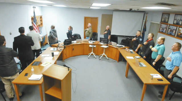 The Devils Lake City Commission begins each meeting with the Pledge of Allegiance.