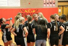 With no upperclassmen, Nelson County girls’ basketball is embracing its youth
Nelson County girls basketball coach Gus Kueber gives his team a pep talk during the 2025 Lake Region Invitational in Devils Lake. (Photo by Mojo Hill)