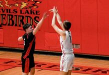 Devils Lake’s youngest Brodina scores 20, defends well in first varsity start for Devils Lake boys’ basketball
Ben Brodina takes a shot in Devils Lakes season-opening win against Grand Forks Red River. (Photo by Cameron Carlson)