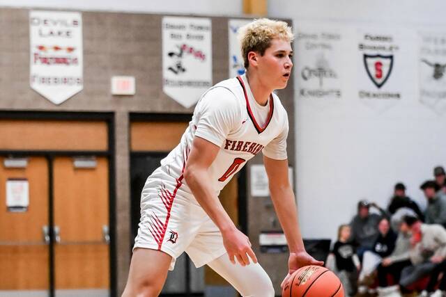Max Palmer dribbles while looking for an opening. (Photo by Cameron Carlson)