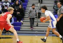 
			
				                                Devils Lakes Egan Laite guards Four Winds/Minnewaukans Dayson Dubois. (Photo by Mojo Hill)
 
			
		