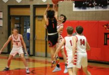 
			
				                                Warwicks Anthony Touche Jr. attempts to get a shot over North Stars Hunter Hagler. (Photo by Mojo Hill)
 
			
		