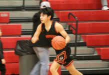Anthony Touche Jr. scores 48 in Warwick’s first win under Robert Lawrence
Anthony Touche Jr. dribbles past midcourt as he initiates the offense during a game in the 2026 Ramsey County tournament. (Photo by Mojo Hill)