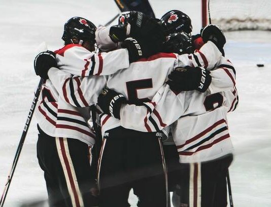 Braxton Boline’s game-winning goal lifts Devils Lake out of losing streak
The Devils Lake boys hockey team comes together to support each other. (Photo by Cameron Carlson)