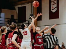 
			
				                                Mia Elsperger leaps during the tip-off against Carrington on Monday, Feb. 2. (Photo by Cameron Carlson)
 
			
		