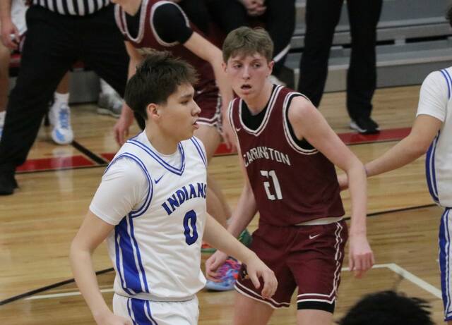 132133208_web1_joran-lohnes-four-winds-2-13-26
Joran Lohnes backpedals while watching the ball during Four Winds/Minnewaukans win over Carrington on Thursday. (Photo by Mojo Hill)