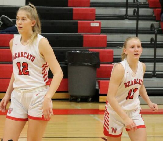 
			
				                                North Stars Annabelle Staus and Claire Jorde compete in the Lake Region Invitational earlier this season. (Photo by Mojo Hill)
 
			
		
