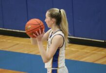 
			
				                                Addisyn Faul looks for an open pass during the District championship on Monday. She later made the game-winning layup. (Photo by Mojo Hill)
 
			
		