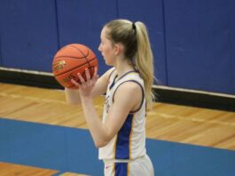 
			
				                                Addisyn Faul looks for an open pass during the District championship on Monday. She later made the game-winning layup. (Photo by Mojo Hill)
 
			
		