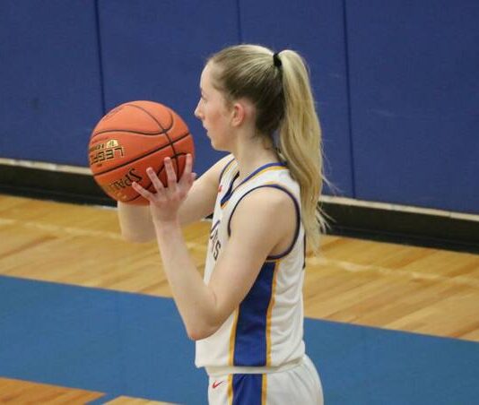 
			
				                                Addisyn Faul looks for an open pass during the District championship on Monday. She later made the game-winning layup. (Photo by Mojo Hill)
 
			
		