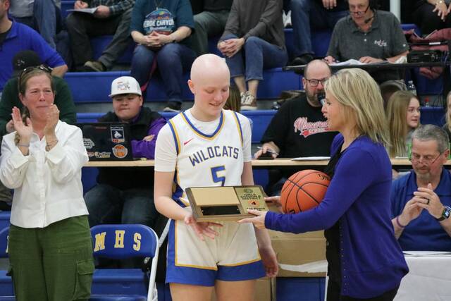 Isabella Engstrom accepts Benson Countys team award.
