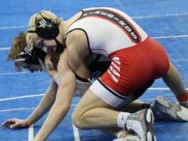 
			
				                                Coby Dronen Levitt wrestles an opponent from No. 1 seed (West) Bismarck Legacy in the 2026 state duals. (Photo by Mojo Hill)
 
			
		