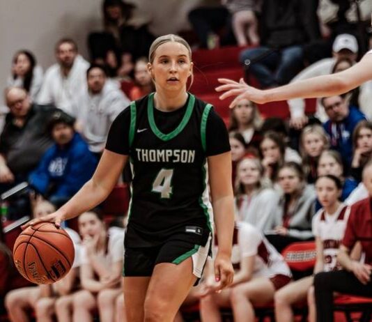 
			
				                                Thompsons Addison Sage looks to dribble around Carringtons Aniston Hoornaert in the Region 2 championship at the Devils Lake Sports Center. (Photo by Cameron Carlson)
 
			
		