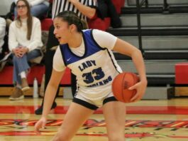 
			
				                                Suri Gourd corrals the basketball during the Region 2 third-place game against Devils Lake at the Devils Lake Sports Center. (Photo by Mojo Hill)
 
			
		