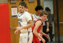 
			
				                                Nelson Countys Rider Schmidt and North Stars Ian Westlind battle in the Ramsey County tournament championship in Devils Lake. (Photo by Mojo Hill)
 
			
		