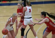 
			
				                                Devils Lakes Mia Elsperger guards Central Casss Jaci Verkuehlen at the top of the arc. (Photo by Mojo Hill)
 
			
		
