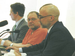 
			
				                                Werner Kunkel at his Jan. 7 evidentiary hearing for a new trial at the Ramsey County Courthouse, seen here seated between (left to right) attorneys Bruce Ringstrom Jr. and James Mayer. His 1995 conviction of the murder of Gilbert Fassett in 1986 was overturned on March 2 by Judge Daniel Narum. (Photo by Louise Oleson)
 
			
		