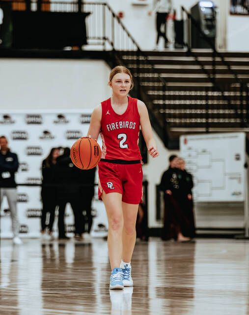 Point guard Ava Beck dribbles across halfcourt. (Photo by Cameron Carlson)