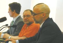 
			
				                                Werner Kunkel at his Jan. 7 evidentiary hearing for a new trial at the Ramsey County Courthouse, seen here seated between (left to right) attorneys Bruce Ringstrom Jr. and James Mayer. His 1995 conviction of the murder of Gilbert Fassett in 1986 was overturned by Judge Daniel Narum. (Photo by Louise Oleson)
 
			
		
