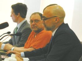 
			
				                                Werner Kunkel at his Jan. 7 evidentiary hearing for a new trial at the Ramsey County Courthouse, seen here seated between (left to right) attorneys Bruce Ringstrom Jr. and James Mayer. His 1995 conviction of the murder of Gilbert Fassett in 1986 was overturned by Judge Daniel Narum. (Photo by Louise Oleson)
 
			
		