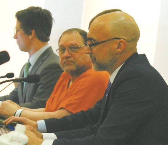 
			
				                                Werner Kunkel at his Jan. 7 evidentiary hearing for a new trial at the Ramsey County Courthouse, seen here seated between (left to right) attorneys Bruce Ringstrom Jr. and James Mayer. His 1995 conviction of the murder of Gilbert Fassett in 1986 was overturned by Judge Daniel Narum. (Photo by Louise Oleson)
 
			
		