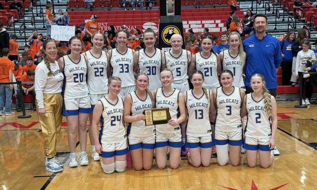 The Benson County Wildcats pose for one last team picture after taking third at the 2026 Division B girls basketball state tournament. (Photo via Maddock Public School Facebook)