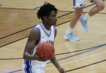 
			
				                                Marial Deng regains possession for the Indians during their quarterfinal matchup with Harvey/Wells County. (Photo by Mojo Hill)
 
			
		