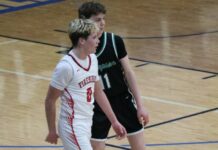 
			
				                                Max Palmer matches up with Thompsons Grady Hurst during the Firebirds quarterfinal matchup with Thompson at Mayville State University. (Photo by Mojo Hill)
 
			
		