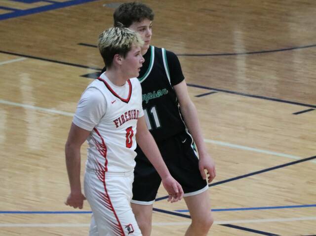 Max Palmer matches up with Thompsons Grady Hurst during the Firebirds quarterfinal matchup with Thompson at Mayville State University. (Photo by Mojo Hill)