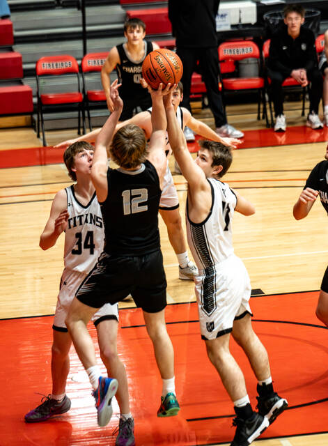 Nelson Countys Zane Anderson reaches up for a ball with Brody Rainsberry watching intently. (Photo by Cameron Carlson)