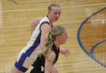 
			
				                                Benson Countys Aubrey Kenner chases after Langdon Area/Munichs Hilary Haaven during the District 4 championship game in Maddock. (Photo by Mojo Hill)
 
			
		