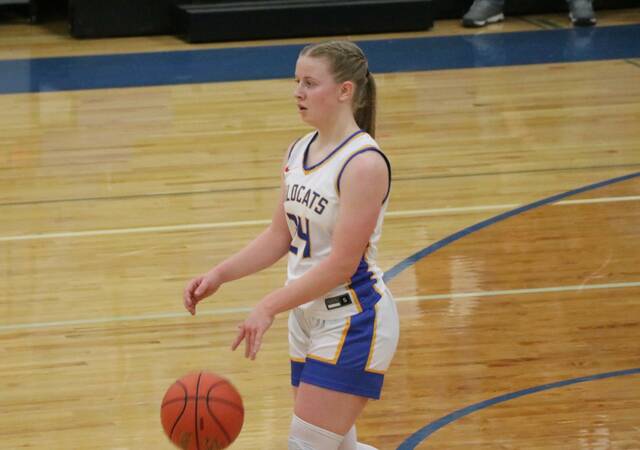 Kaitlyn Maddock dribbles the ball down the court while initiating Benson Countys offense. (Photo by Mojo Hill)
