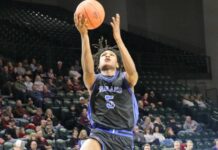 
			
				                                Marial Deng leaps to the basket during Four Winds/Minnewaukans state qualifier game against Oak Grove in Fargo. (Photo by Mojo Hill)
 
			
		