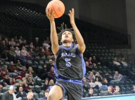‘We finally did it’: Indians clinch first Division A state appearance with win over Oak Grove
Marial Deng leaps to the basket during Four Winds/Minnewaukans state qualifier game against Oak Grove in Fargo. (Photo by Mojo Hill)