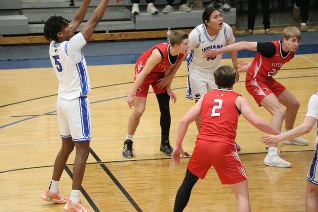 Four Winds/Minnewaukans Marial Deng shoots a free throw in a game against Devils Lake at Mayville State University. (Photo by Mojo Hill)