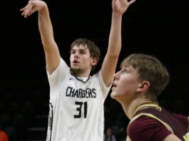 ‘I can’t believe it’: Nelson County ends state drought with shutout third quarter against Linton/HMB
Rider Schmidt shoots a free throw for Nelson County on Saturday in the Chargers state qualifier game against Linton/HMB. (Photo by Mojo Hill)