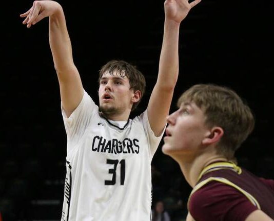‘I can’t believe it’: Nelson County ends state drought with shutout third quarter against Linton/HMB
Rider Schmidt shoots a free throw for Nelson County on Saturday in the Chargers state qualifier game against Linton/HMB. (Photo by Mojo Hill)