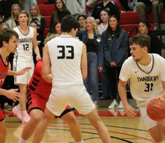 Seeding announced for Division B boys’ basketball state tournament
Nelson Countys Rider Schmidt dribbles with North Stars Hunter Hagler guarding him during the 2026 Ramsey County boys basketball tournament at the Devils Lake Sports Center. (Photo by Mojo Hill)