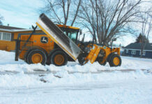 
			
				                                First, a grader cuts down the ice and snow that have accumulated on each side of the citys streets and avenues bringing it into the center of the roadway. (photos by Louise Oleson, DLJ Editor)
 
			
		